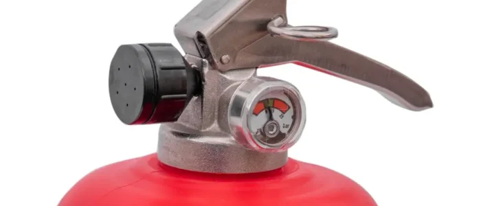Close-up of the handle, pressure gauge and nozzle on a Britannia P50 water mist extinguisher